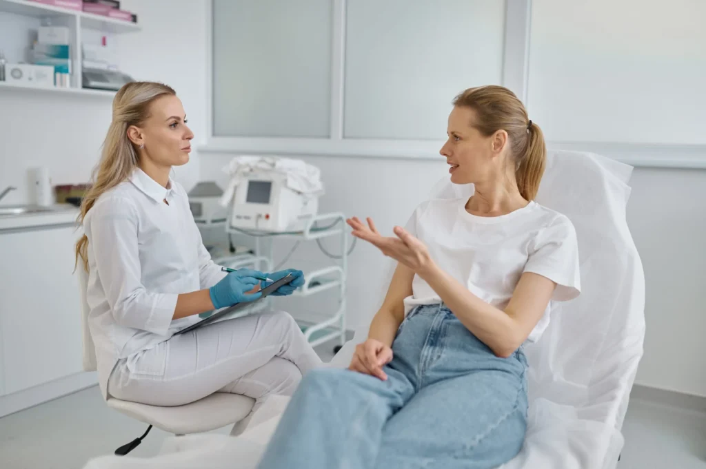 A skincare consultation between a specialist and a client discussing Skin Rejuvenations treatments.